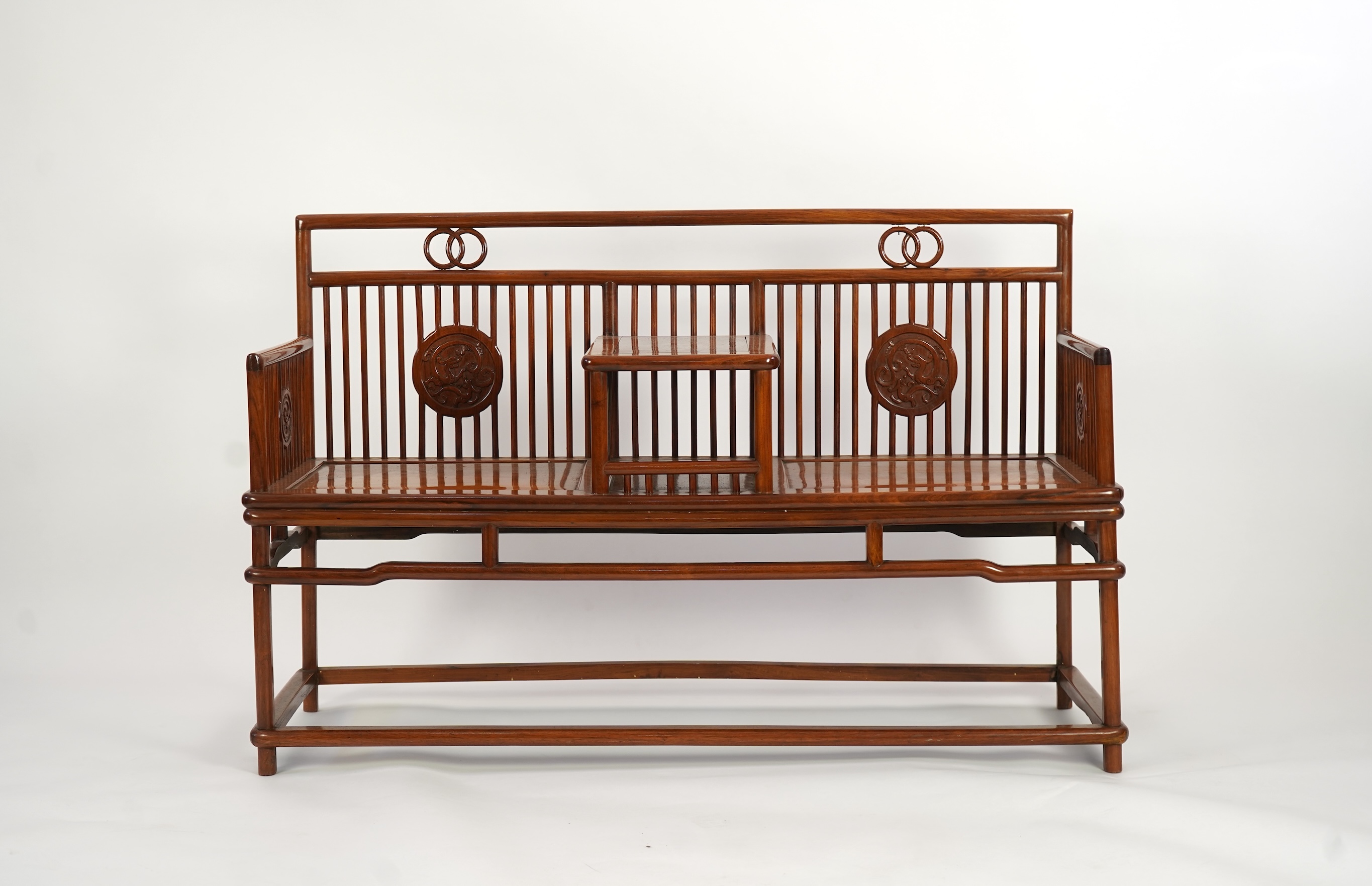 A Chinese hardwood and burrwood inset spindle-back bench, early 20th century